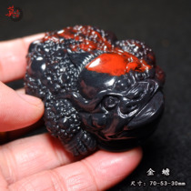 Guilin chicken blood jade solitary piece golden toad handle red material on black background hand-carved lucky toad