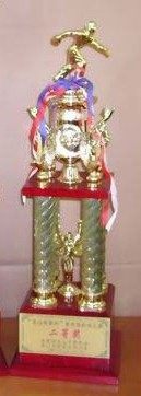 Four large trophies with a large trophy