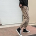 LMTNZD quần hip hop mùa đông nam hoang dã thả lỏng chân kaki cổng gió dụng cụ thủy triều quần dài nam Quần mỏng
