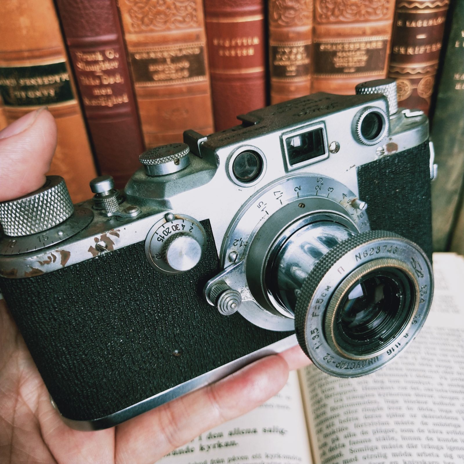 1949 German Leica Leica LeicaIIIc machinery next to shaft 135 glued to camera with Soviet lens