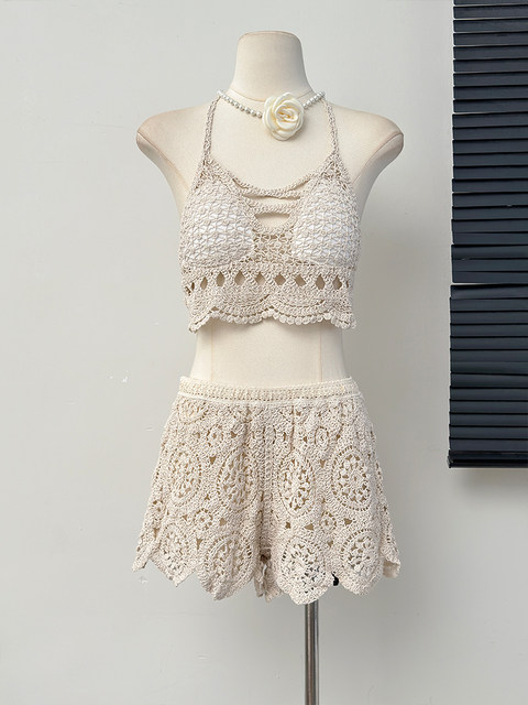 Beach vacation fashionable casual suit, feminine hollow knitted camisole, high-waisted wide-leg shorts two-piece set