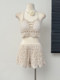 Beach vacation fashionable casual suit, feminine hollow knitted camisole, high-waisted wide-leg shorts two-piece set