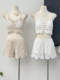 Beach vacation fashionable casual suit, feminine hollow knitted camisole, high-waisted wide-leg shorts two-piece set