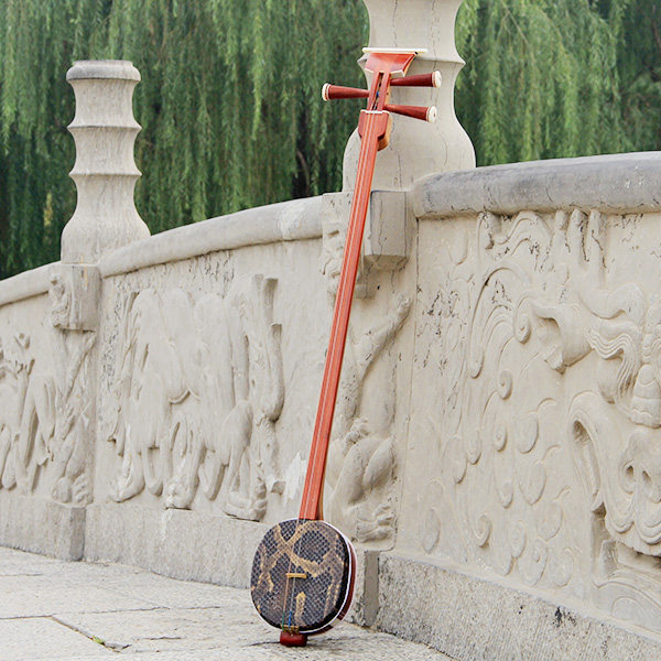 Three string national pluctions in red wood material for professional playing with piano manufacturer to promote Sanskrit brand giveaway accessories