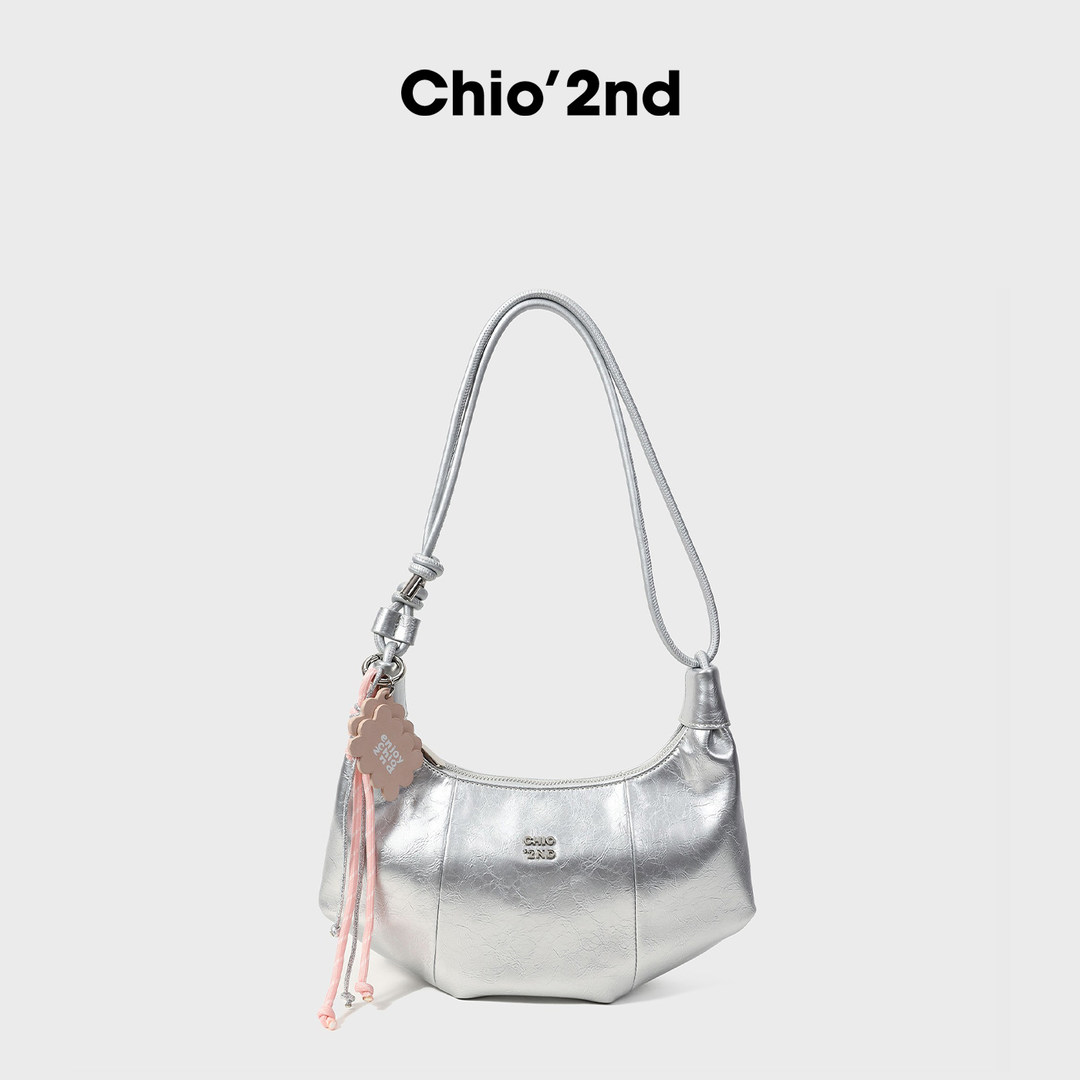 Silver metallic shoulder handbag with long strap and charm detail