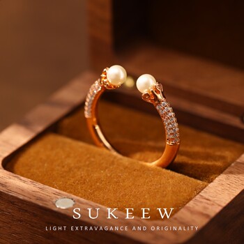 Suko french niche double-headed ring