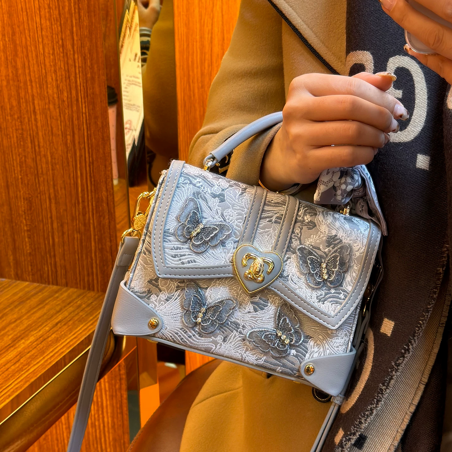 Handheld bag, genuine leather, with embroidery