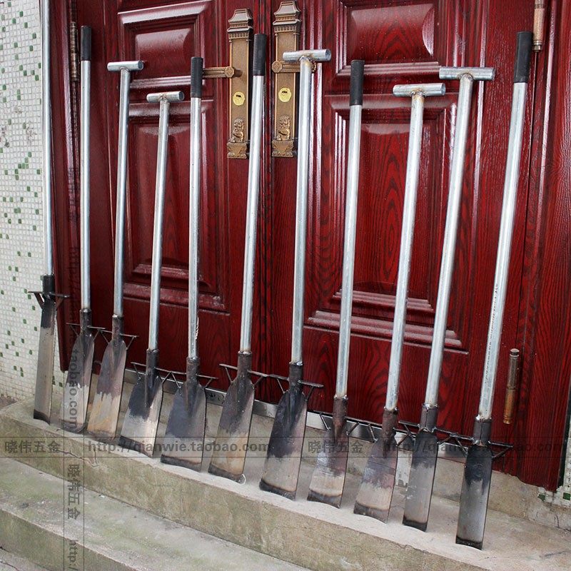 Manganese steel thickened with a shovel shovel dredger digging a tree shovel digging tree tool digging tree tool outdoor shovel moving tree deity