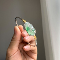 A touch of spring green on the wrist of a cloud jadeite floating green Ruyi open bracelet inlay style reference