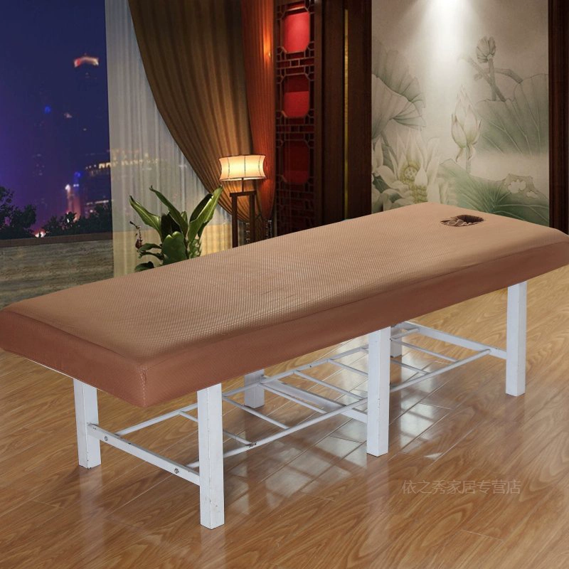 Giường của giường làm đẹp có một lỗ, và lớp phủ bụi của giường massage được gấp lại. - Trang bị Covers