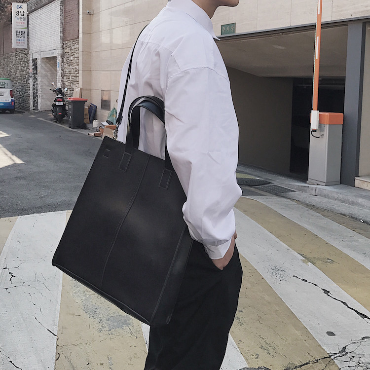 KAFKAsSHOP simple rectangular men and women couple pu leather hand carry cross shoulder bag Korean chao personality street shot