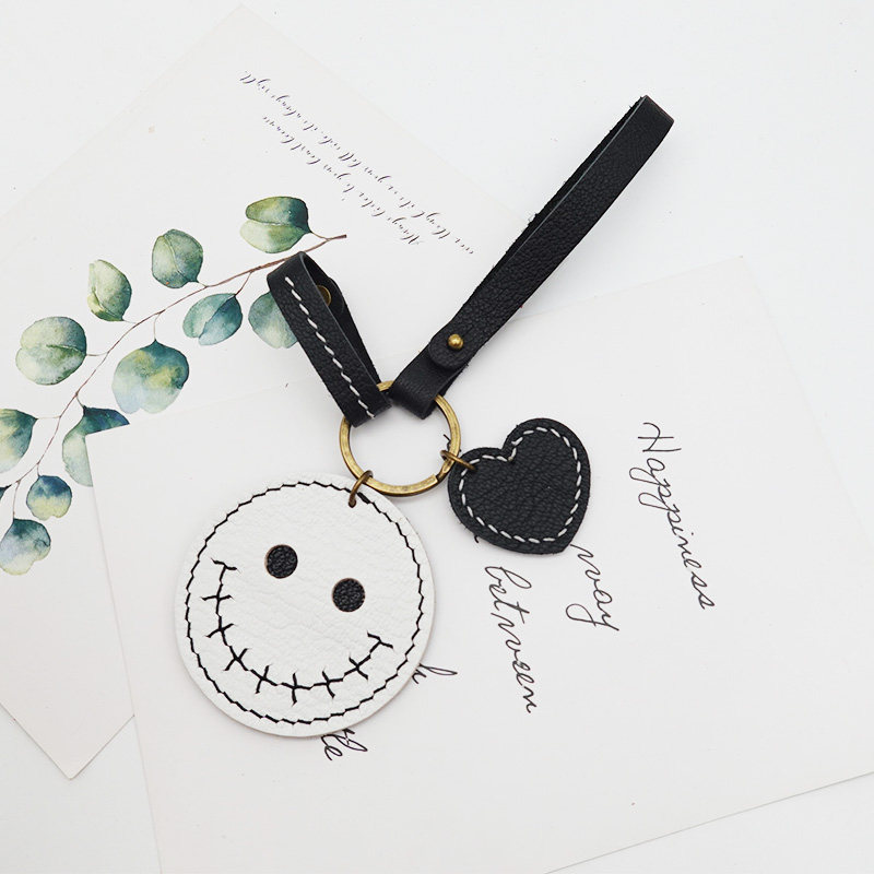 Small skull demon handmade leather car key chain bag hanging diy material bag with cut hole gothic style smiley face