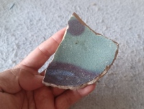 Fragment of the bottom of an ancient Jun porcelain bowl from the Yuan Dynasty. Two red spots. Good color. Good specimen for study.