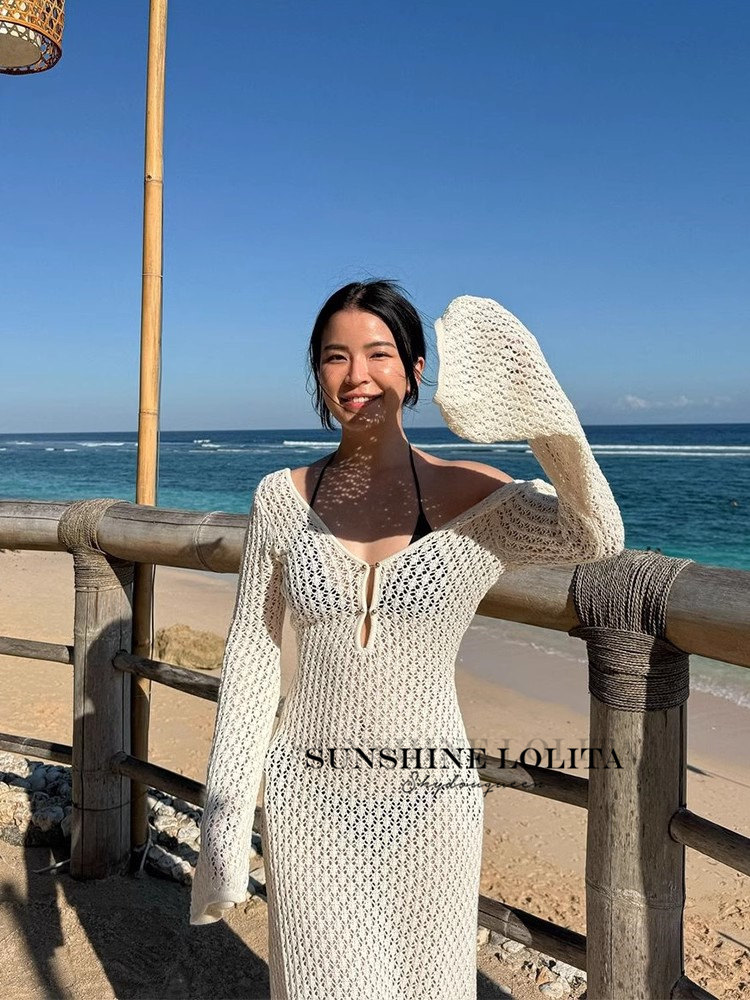 Light and breezy summer vibes meet chic design in this v-neck, open-knit,  loose-fitting, long-sleeved maxi dress  the ultimate beach vacation  essential!