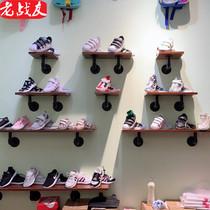 Womens sweaters hang on the walls of the clothing store to recall the fathers Golden Autumn childrens clothing display rack Bag rack shelf shoe rack