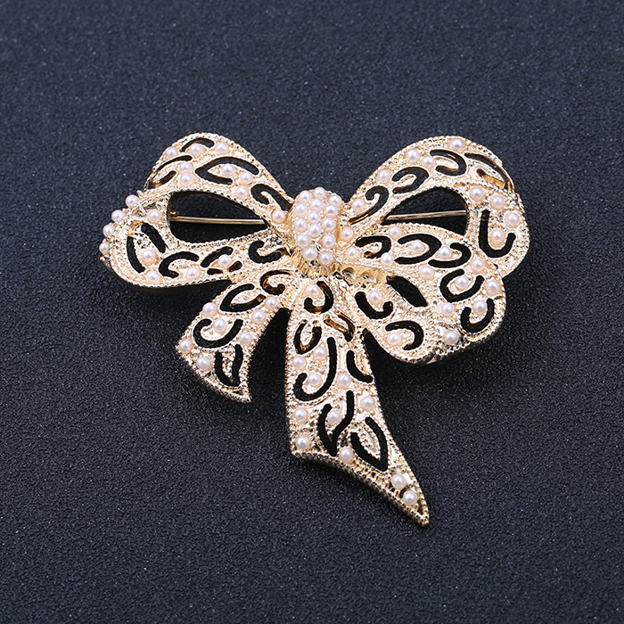 [Golden Phoenix] Trang sức thời trang châu Âu và châu Mỹ mới ngọc trai rỗng nơ áo tinh tế trâm cài nữ - Trâm cài cài áo