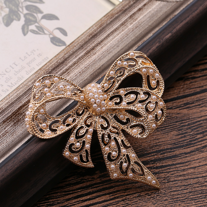 [Golden Phoenix] Trang sức thời trang châu Âu và châu Mỹ mới ngọc trai rỗng nơ áo tinh tế trâm cài nữ - Trâm cài cài áo