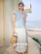 Xiangying ສີຟ້າ hollow ເສື້ອດອກໄມ້ແມ່ຍິງ 2026 summer ໃຫມ່ເຄິ່ງເປີດ v-neck ເສື້ອ doll ເດັກນ້ອຍ lazy
