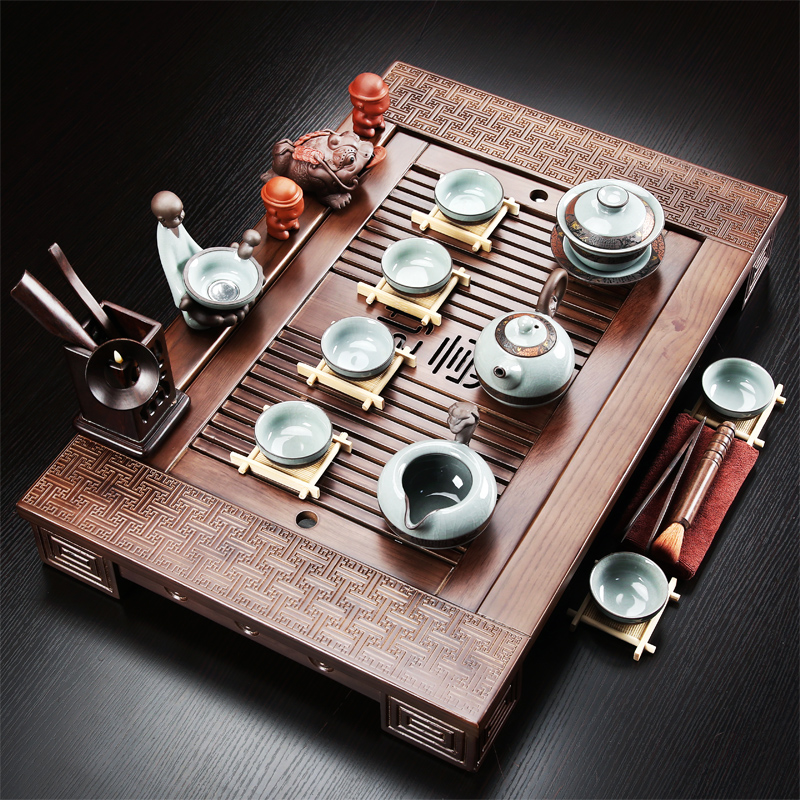 A complete set of purple sand tea set solid wood tea tray tea home office ceramic kung fu tea set the teapot tea accessories