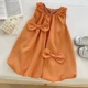 Оранжевое платье без рукавов с бантиком