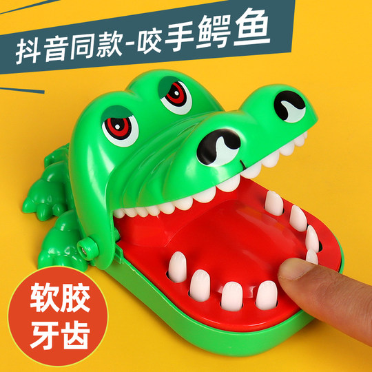 Biting fingers, little crocodile, children's dinosaur, tricky toy, boy, pressing teeth, big shark, biting, mouth, pulling teeth