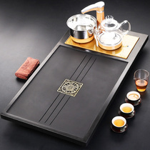 The whole piece of natural black gold stone tea tray four-in-one electric stove household simple modern Kung Fu tea table tea sea drainage