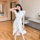 Small white French dress female design sense three-dimensional ruffle edge irregular hem slim fit hip dress