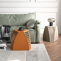 Shoe-changing stool household low stool light luxury designer living room saddle leather sofa Ottoman personality hollow side several stools