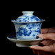 Jingdezhen hand-painted horseshoe-shaped three-cai covered bowl, underglaze blue and white porcelain landscape tea bowl, Kung Fu tea set