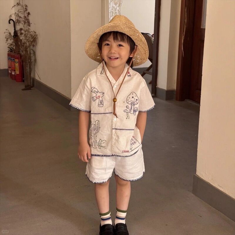 Korean Children's Clothing 2026 Summer New Style Off-White Suit Collar Cartoon Graffiti Shirt Children's Stitched Shorts Set