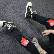 European and American High Street wind West Coast cashew flower stitching patch tide male hip hop elastic slim black small foot jeans