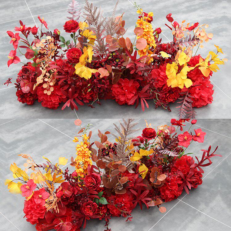 The new wedding road leads to a large red flying oatmeal with a floral stage background decorative floral art.