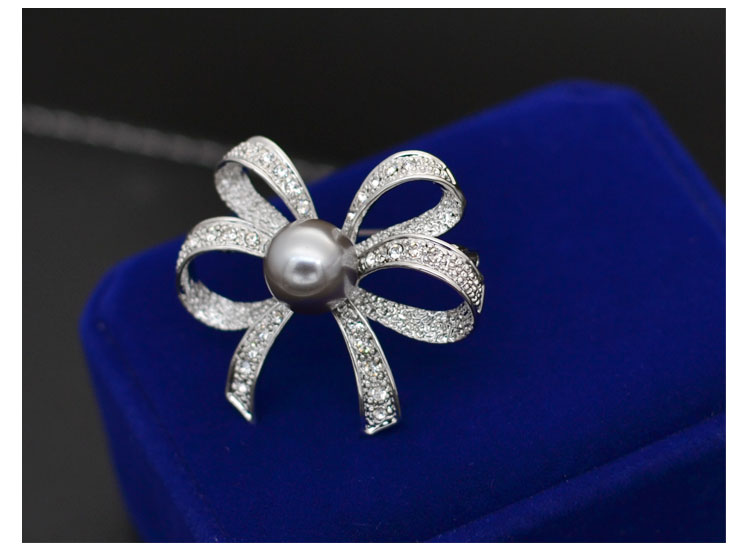 Thời trang Hàn Quốc Wild Pearl Bow Trâm Áo khoác nữ Áo len Áo len Pin Retro Suit hoa cài áo