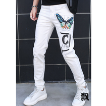 Mens white jeans 2020 spring and summer new elastic slim feet small feet Europe and America Tide brand handsome graffiti fashion