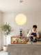 Nordic Minimalist Round Moon-Shaped Living Room Pendant Light, Japanese Wabi-Sabi Style Lampshade, Cozy Café Ambiance, Exhibition Hall Lighting