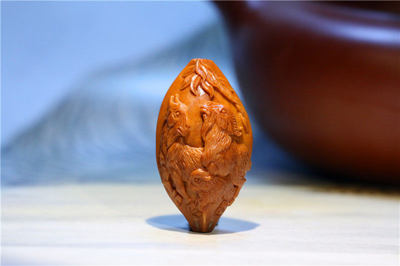 Ziyunhui olive core carving old oil core famous hand-carved three sheep Kaitai single seed