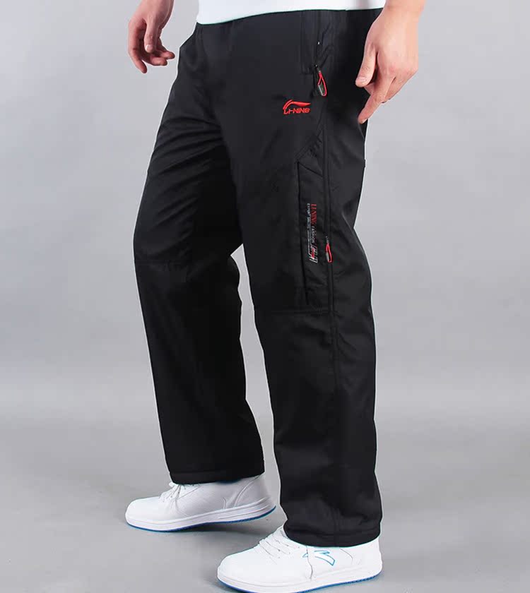 Li Ning mùa đông cộng với quần nhung nam rộng rãi dày ấm áp áo gió mưa lụa nam thể thao quần dài quần áo nam hàng hiệu