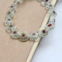 Прозрачные маленькие голубые цветочки 10мм, около 36 штук.