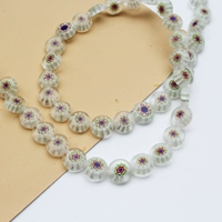 Прозрачные маленькие синие цветочки 8мм, около 44 штук.