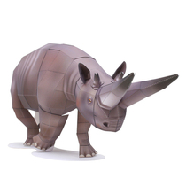 The 3D paper model of rhino before historic animal Egypt by hand - made by childrens puzzle DIY