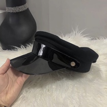 Super good wearing a small patent leather hat