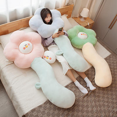 The flower-shaped pillow sofa is super soft and cute. It's a bedside cushion for girls to sleep on and a long leg pillow for the dormitory