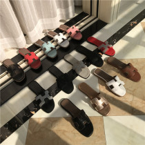 Slippers women wear 2022 new summer black rhinestone leather Joker fashion net red beach white sandals and slippers tide