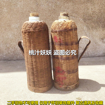Old-fashioned nostalgic warm water bottle bamboo rattan hot water bottle folk old objects farmyard retro display old goods