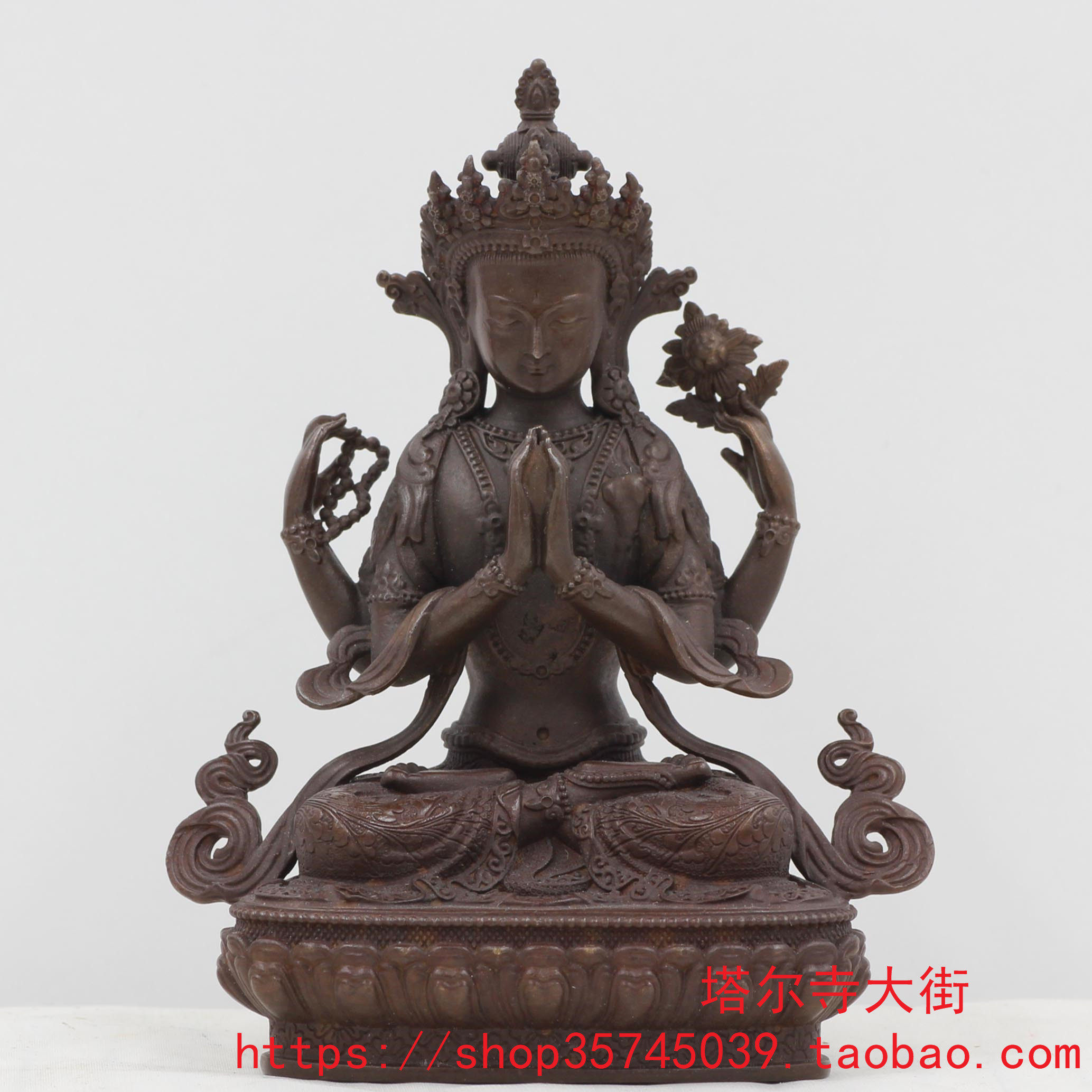 The antique four-armed Guanyin Buddha statue is produced from Ta'er Temple. The size is 3 inches (9cm).