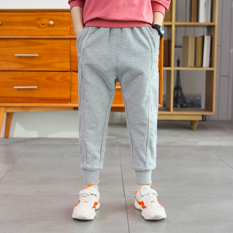 Trẻ em mùa xuân và mùa thu eo cao sweatpants bông bé trai sinh lỏng quần bảo vệ miệng bé trai dệt kim quần mặc bên ngoài.