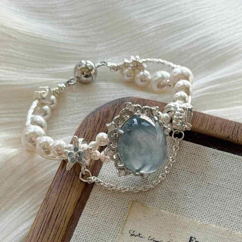 Deep Sea Letter: Sea Blue Egg-Shaped Imitation Pearl Magnetic Bracelet, Fashionable Commuting Starfish Bracelet with Diamond Inlay That Enhances Fairness Deep Sea Letter: Sea Blue Egg-Shaped Imitation Pearl Magnetic Bracelet, Fashionable Commuting Starfish Bracelet with Diamond Inlay That Enhances Fairness