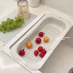 Adjustable telescopic drain rack ins air simple household kitchen wash basin sink drain basket pool storage rack