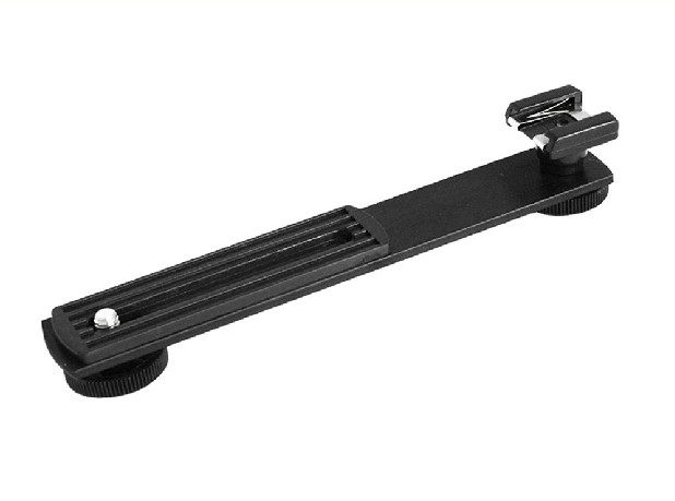   The external flash holder secures both the camera and the flash lever at the same time