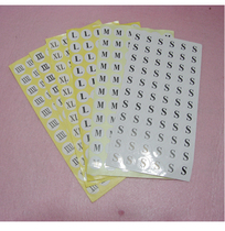 Self-adhesive clothing size sticker on white background black lettering size sticker (S-XXXL code label)